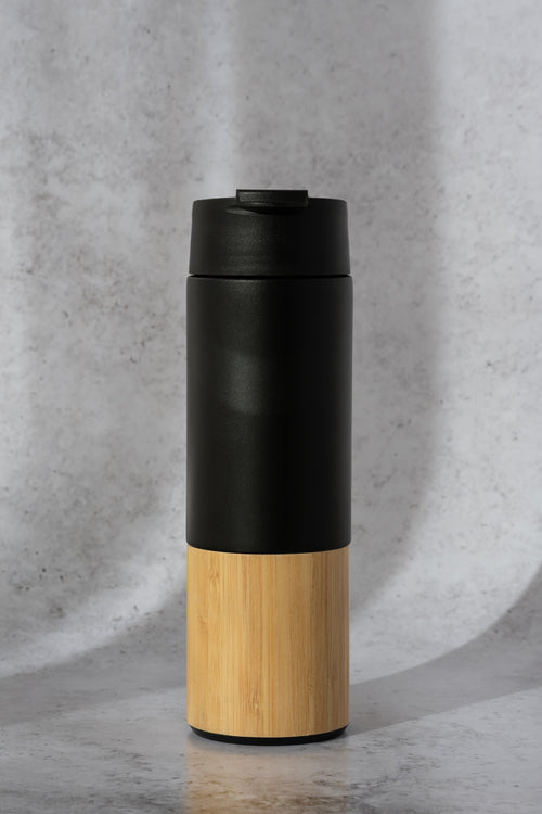 Matte black insulated stainless steel travel mug with bamboo texture bottom for corporate employee gift packs